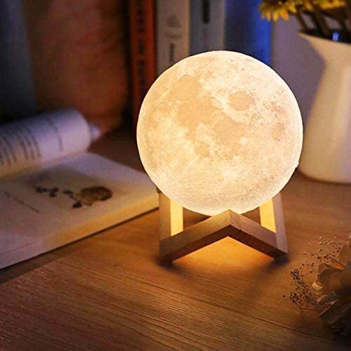 Luminária de mesa em formato de lua cheia. 